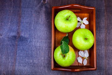 Green apples, flowers and leaves