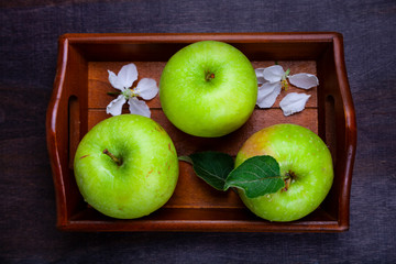 Green apples, flowers and leaves