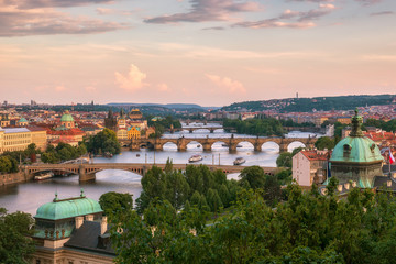 Fototapeta na wymiar Beautiful Prague and its bridges / Aerial view of famous bridges in Old Town of Prague in Czech Republic over Vltava river before the sunset.