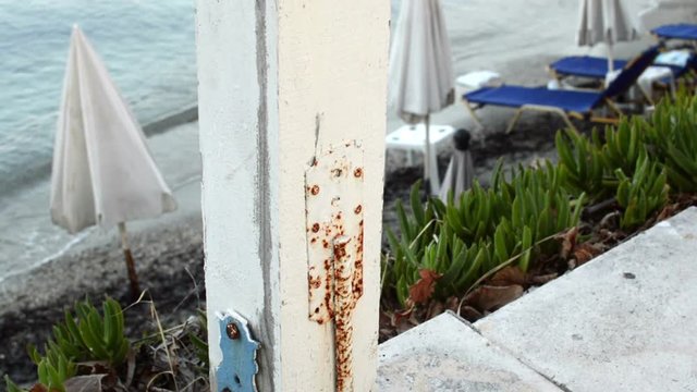wooden pillars connected with white rope marking the end of the terace