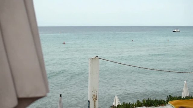 wooden pillars connected with white rope marking the end of the terace