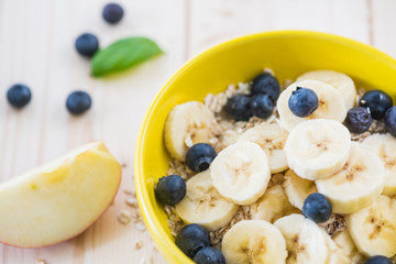 ood morning, great start to the day.  .Morning breakfast set with bowl of fruits apples and blueberry.