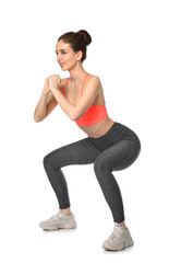 Sporty woman training on white background