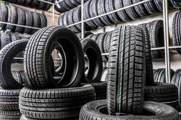 Car tires in automobile store - obrazy, fototapety, plakaty