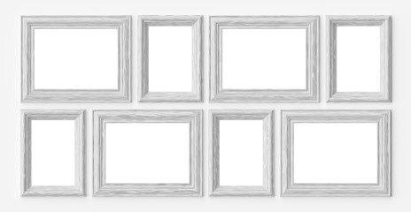 White wooden frames for picture or photo on white wall with shad