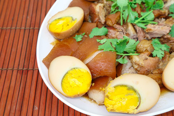 fried eggs with bacon and bacon on plate