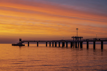 Fototapeta premium Beautiful sunrise at The Bridge in Burgas. Symbol of the city. 
