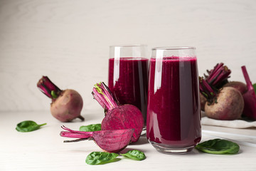 Glasses of fresh beet smoothie on table