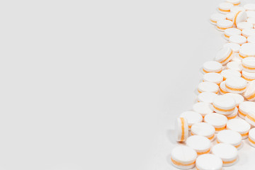 White pills, painkillers on a white background. Concept healthcare and medicine free space for text.