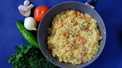  pilaf in a cauldron with vegetables and spices