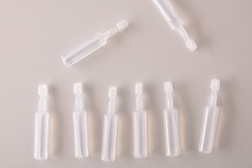 Pipettes eye drops on white table top