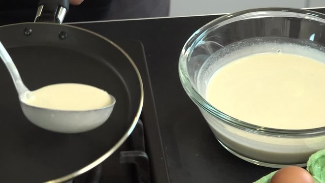 crepe with frying pan in kitchen