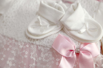 A newborn baby girl background. Close-up of baby shoes 