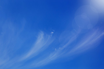 Naklejka na ściany i meble Beautiful blue sky with white clouds. Abstract nature background