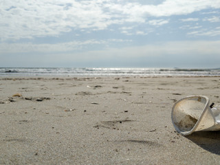 Fototapeta na wymiar plastic jars by the sea