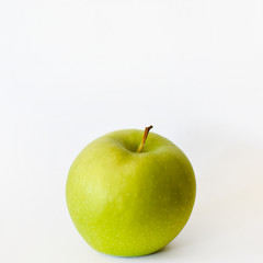 green Apple on white background close-up