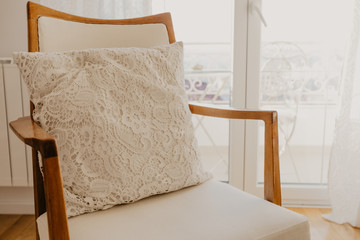 Fototapeta na wymiar white armchair with plaid and pillow . Provence style