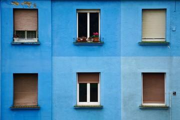 Fototapeta na wymiar window on the blue building facade in Bilbao city Spain, window in the street