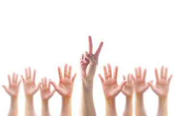 Participation, leadership, volunteer concept with V- Victory sign on leader's two fingers among blur hands crowd isolated on white background