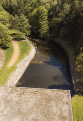 Drain from hydroelectric power plant into river.