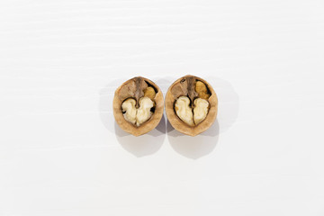 open heart shaped walnut on white background