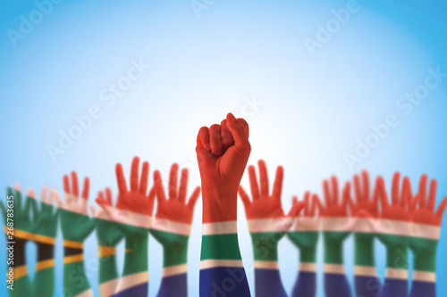 South Africa national flag pattern on leader's fist hands (clipping path)  for human rights, leadership, reconciliation concept