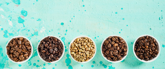 Panorama banner with raw and roasted coffee beans