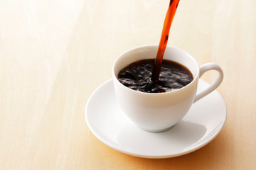 コーヒー　Coffee cup on wooden background