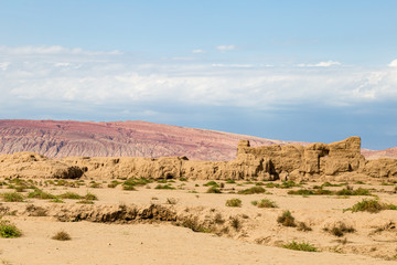 Ruins of Gaochang, Turpan, China. Dating more than 2000 years, Gaochang and Jiaohe are the oldest and largest ruins in Xinjiang. The Flaming mountains are visible in the background