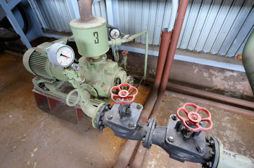 Electric engine, pump, valves set at the hall of the pumping station