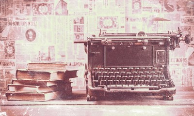 Old typewriter with books  on background