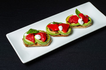Bread with zucchini zucchini and red sweet pepper grilled.