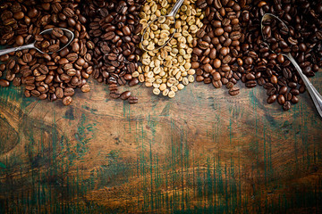 Vintage or rustic border of coffee beans on wood