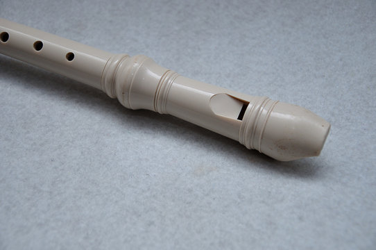 A block flute displayed on a white background