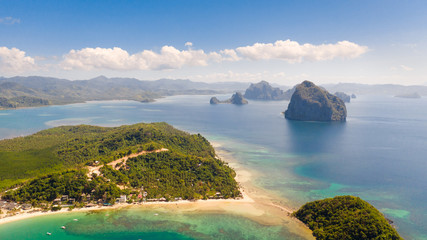 Las Cabanas Beach. Islands and beaches of El Nido.Tropical islands with white sandy beaches, aerial...