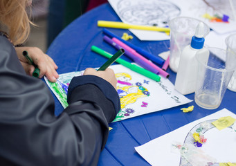 The child is engaged in creativity and crafts