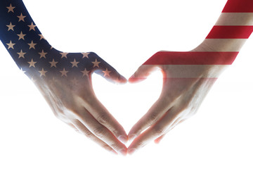 Isolated woman human hands in heart shaped with the United States of America flag pattern