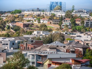 Elevated view of Melbourne's suburban houses near Maribyrnong River.