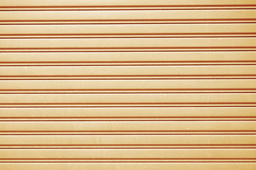 Zinc plate brown background close up