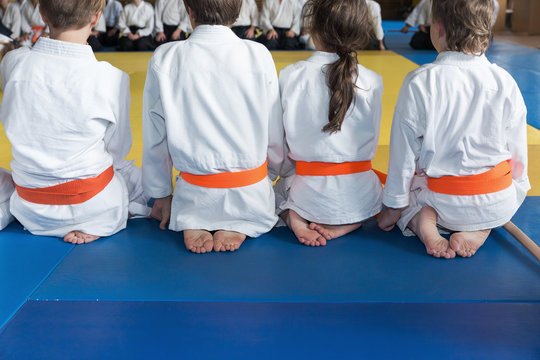Group of children in kimono sitting on tatami
