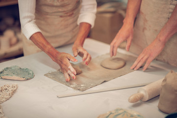 Close up of female hands during working process