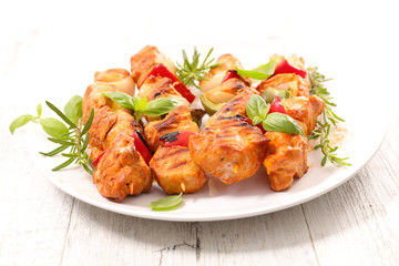 fried chicken barbecue with tomato and herbs