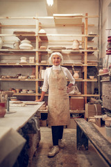 Joyful aged woman having her own business