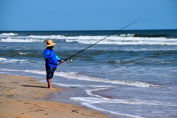 Unrecognizable person Surf fishing hoping to catch a fish at St. Augustine, Florida