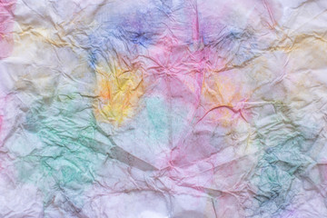 abstract watercolor pattern on crumpled paper