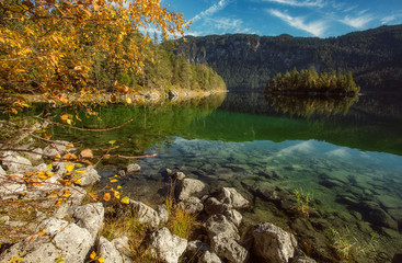 Impressive Autumn landscape The Eibsee Lake in front of the Zugspitze under sunlight. Amazing sunny day on the mountain lake. concept of an ideal resting place. Eibsee lake in Bavaria, Germany