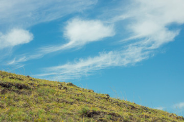 picturesque hill against the blue sky. Serenity