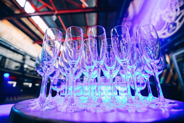 Many Empty champagne glasses with party light