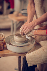 Fototapeta na wymiar Clay pot being made on the pottery wheel