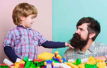 Best weekend ever. happy family leisure. small boy with dad playing together with brick toy. child development. brick building home with colorful brick constructor. father and son play game